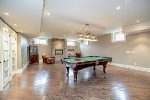 Recreation room with gas fireplace - Country homes for sale and luxury real estate including horse farms and property in the Caledon and King City areas near Toronto