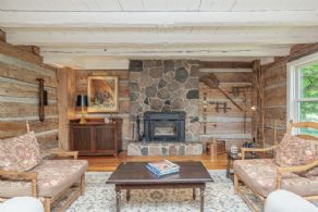 Stone fireplace in living room - Country homes for sale and luxury real estate including horse farms and property in the Caledon and King City areas near Toronto