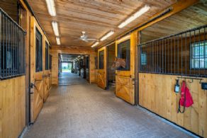 Main Aisle in Stable - Country homes for sale and luxury real estate including horse farms and property in the Caledon and King City areas near Toronto