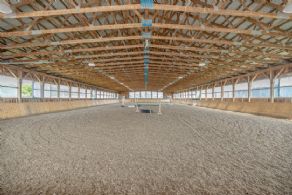 Interior of Indoor Arena + Heated Viewing Stands - Country homes for sale and luxury real estate including horse farms and property in the Caledon and King City areas near Toronto
